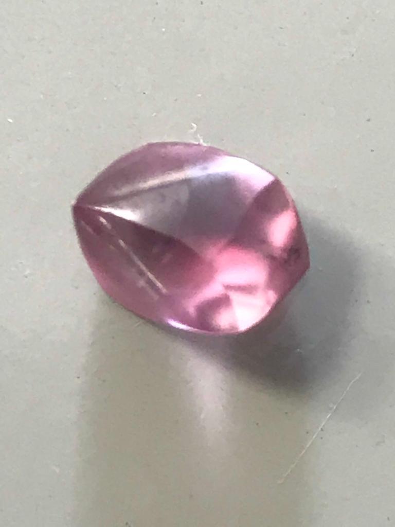 A gemstone held in hand